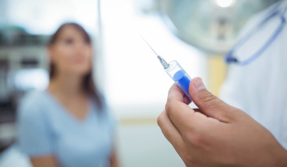 doctor-preparing-syringe-give-injection_107420-74198 Vaccine manufacturing drives jobs surge