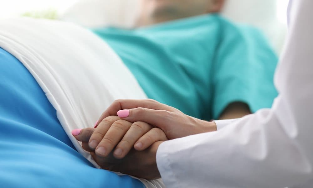 Female doctor hands hold male arm in medical hospital English trust signs Synopsis digital deal