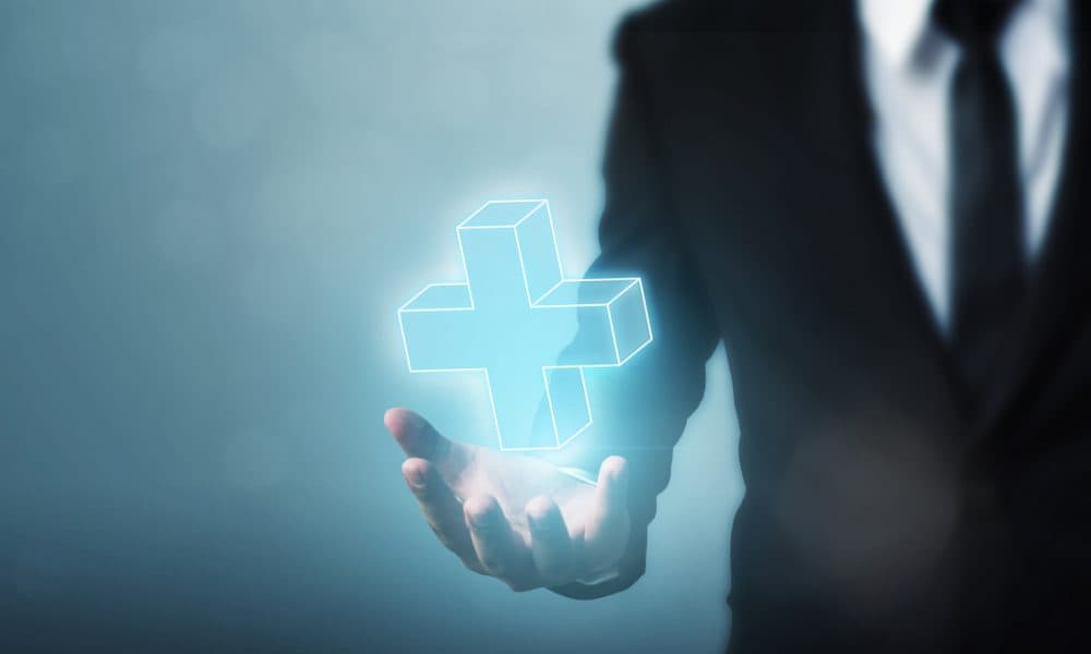 Businessman hand holding plus sign virtual means to offer positive thing (like benefits, personal development, social network) Trust joins world’s biggest healthcare entrepreneur training programme