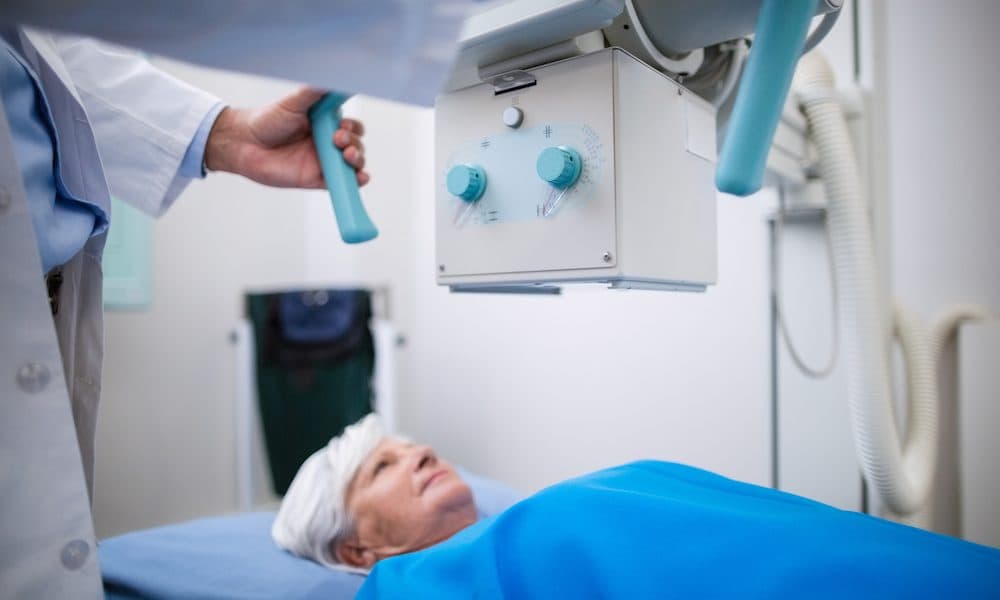 Senior woman undergoing an x-ray test in hospital Yorkshire trust signs new image sharing tech deal