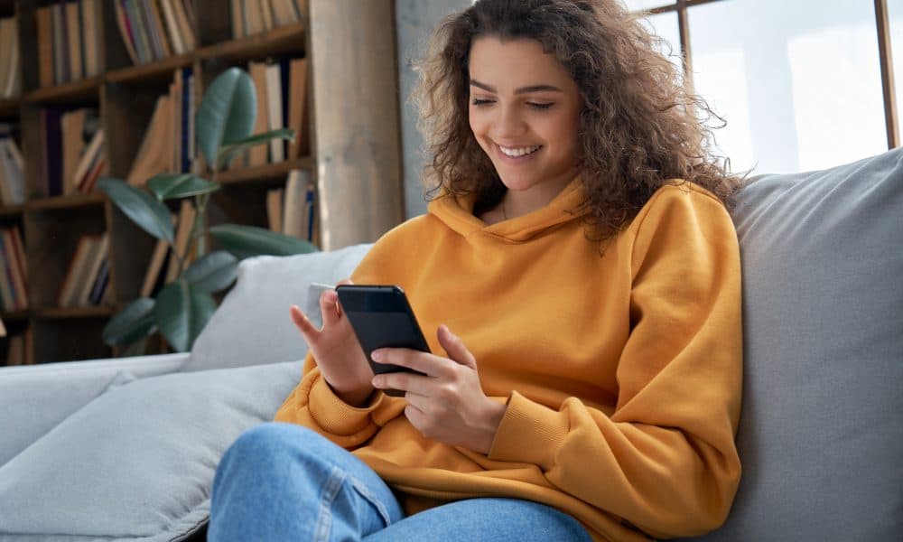 Happy,Millennial,Hispanic,Teen,Girl,Checking,Social,Media,Holding,Smartphone 5 on Friday: The five female focused apps you should know