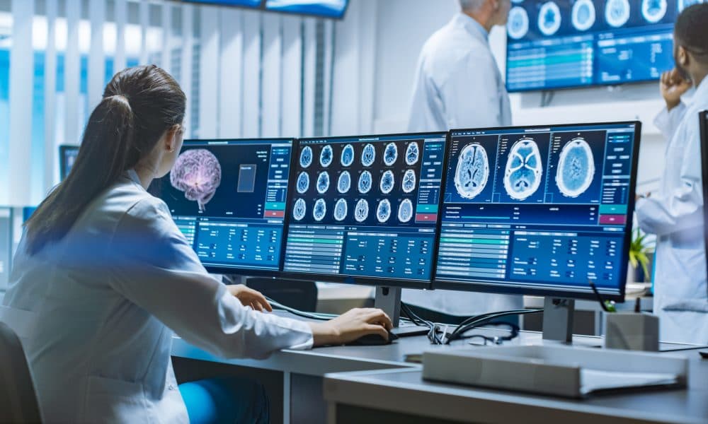 Team of Professional Scientists Work in the Brain Research Labor Teamwork and digitalisation no-brainers for neuroscience advances