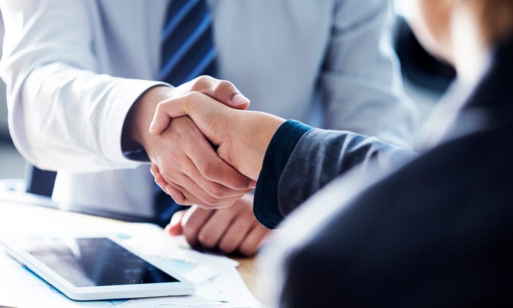 Business handshake in the office CN Bio appoints Dr Paul Brooks as Chief Business Officer