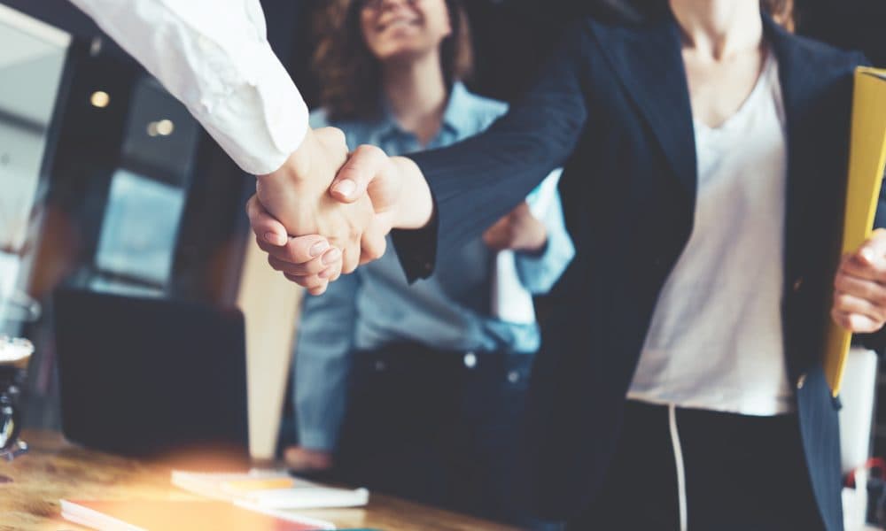Young business people shaking hands in the office. Finishing suc SQZ Biotechnologies appoints Marshelle Smith Warren, M.D. as CMO