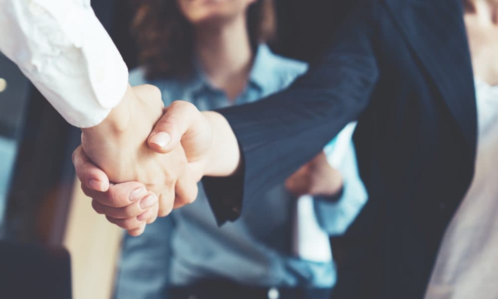 Young business people shaking hands in the office. Finishing suc SHIL appoints two new staff amid 20th anniversary expansion plans