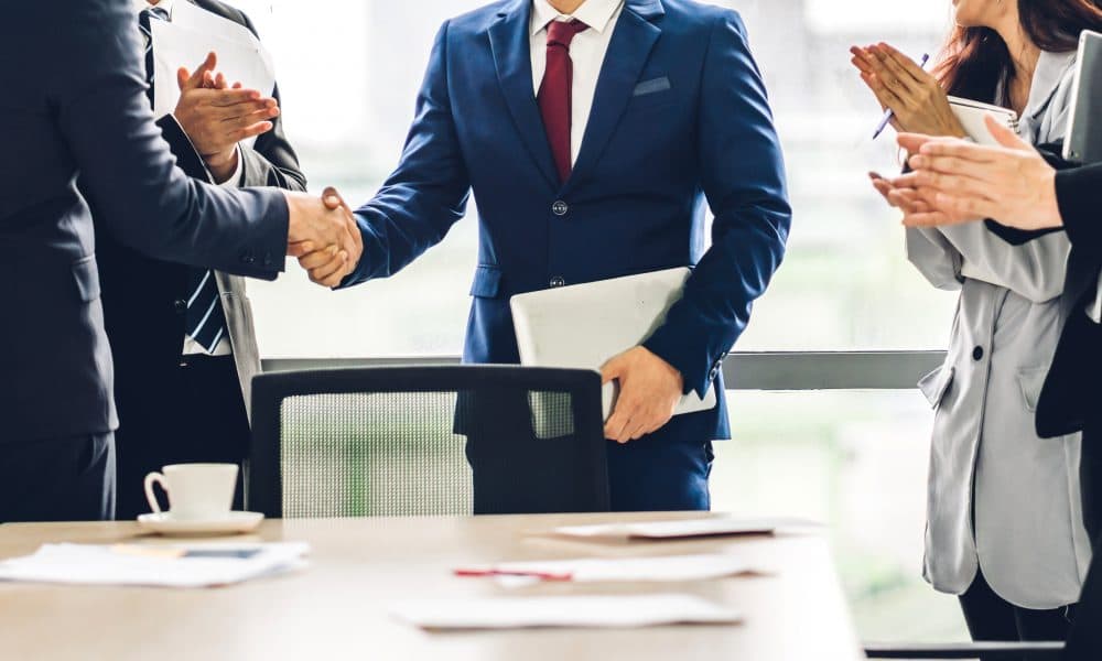 Image two business partners in elegant suit successful handshake Aspect Biosystems appoints trio to board