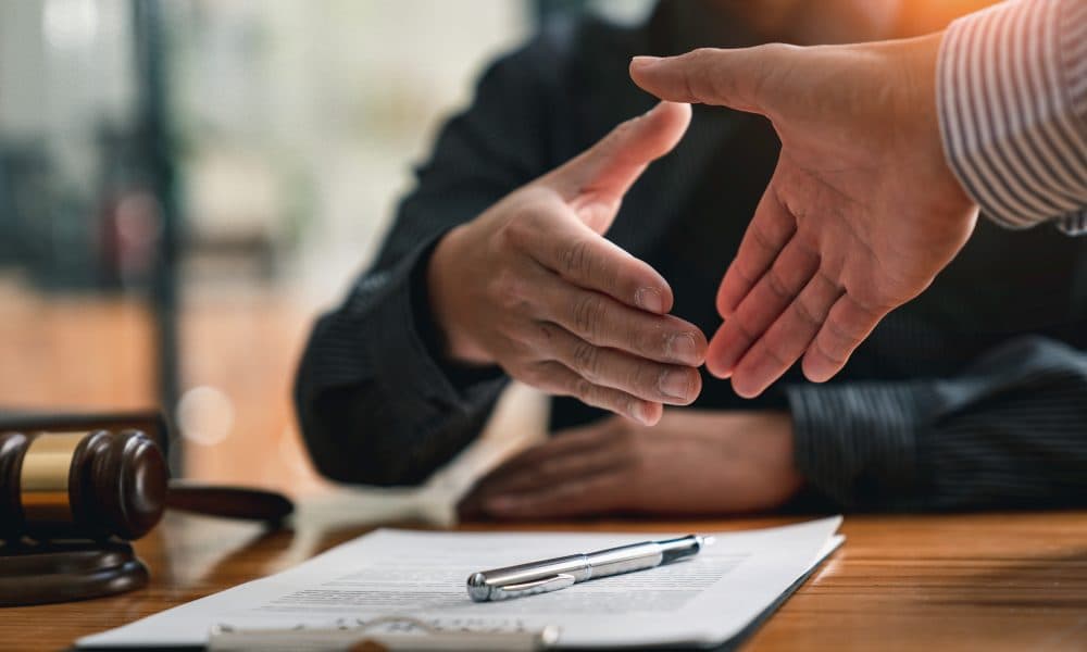 Lawyers shake hands with business people to seal a deal with par Sudo Biosciences appoints new Chief Business Officer