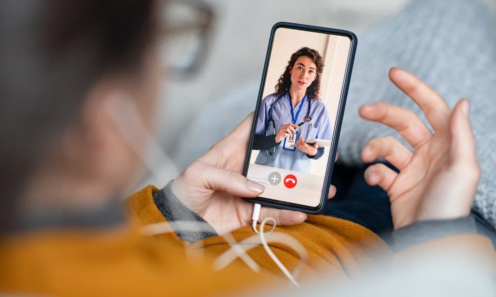 Woman doing video call with doctor How the Internet of Things is making virtual wards a reality