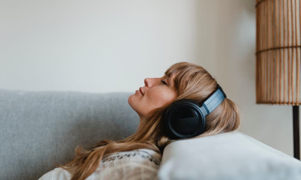 Woman listening to music at home during coronavirus pandemic ‘Binaural beats’ could treat language disorders