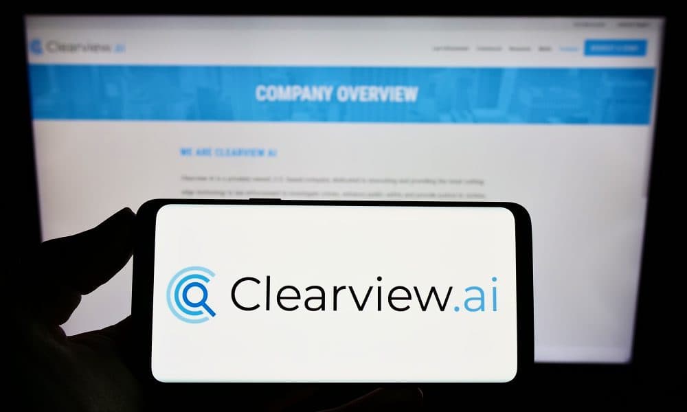 Stuttgart, Germany – 05-26-2022: Person holding smartphone with logo of facial recognition company Clearview AI Inc. on screen in front of website. Focus on phone display. ICO seeks permission to appeal Clearview AI Inc’s successful challenge