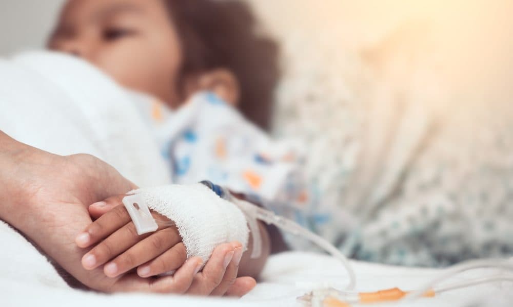 Mother hand holding child hand who have IV solution in the hospi Generative AI used to create translatable paediatric care videos for LMIC hospitals