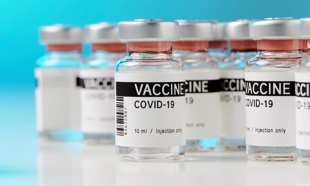 ampoules with Covid-19 vaccine on a laboratory bench. to fight the coronavirus / sars-cov-2 pandemic. Model predicts who benefits most from Covid-19 boosters