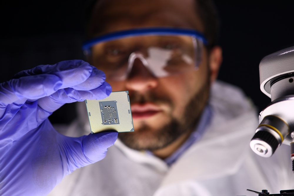 close-up-male-hand-holding-computer-microcircuit-professional-technician-examining-microchip-with-microscope-computer-electronics-technique-concept Smart wound care development could reduce infection risk