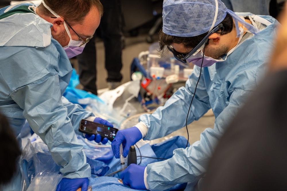 Paris street medics keep cardiac arrest patients alive with rescue therapy, helped by handheld ultrasound and AR